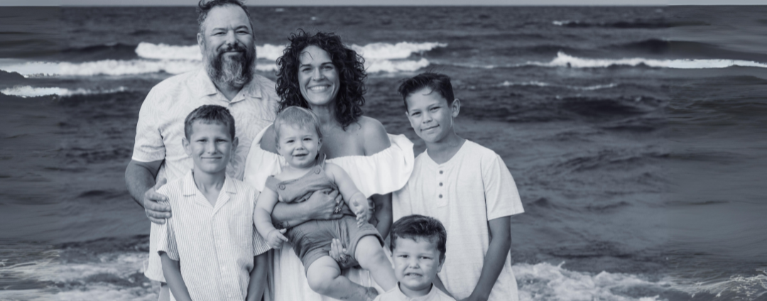 Matthew, Ingrid and family on a beach