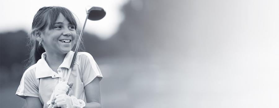 Young girl golfing