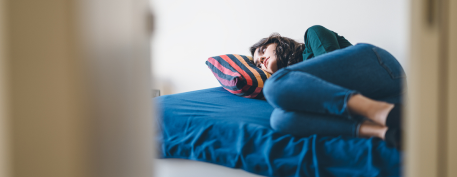 Woman lying in bed.