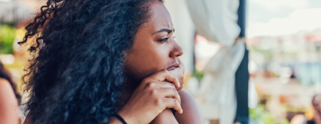 A woman who looks like she is in deep thought. 