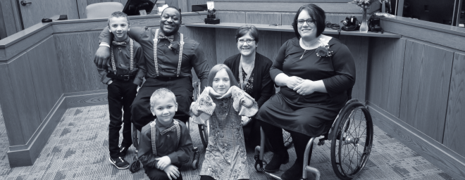 Anna and Master Kinkle at the adoption ceremony with their three kids