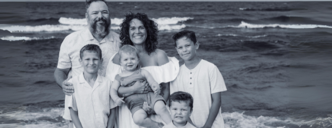 Matthew, Ingrid and family on a beach